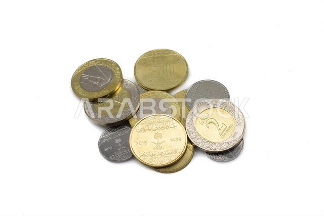 A collection of Saudi Arabian isolated coins, shot close up in macro on a white, clean background