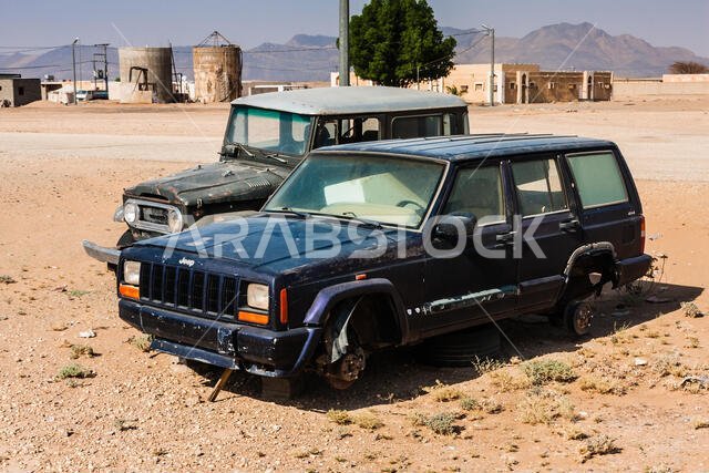Abandoned vintage cars in an unnamed small settlement near the Makkah Al Mukarramah Road