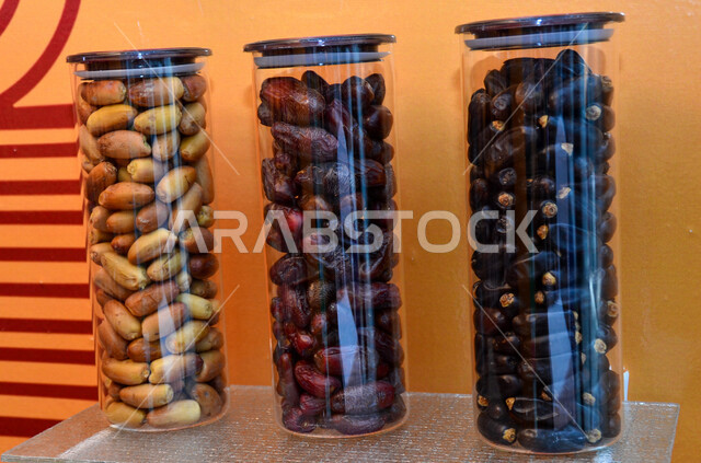 A close-up image of layers of healthy Ajwa dates, a meal with a high nutritional value, Ramadan hospitality, types of healthy and delicious dates, Ajwa dates, white background