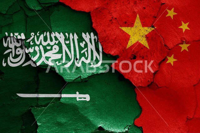 flags of Saudi Arabia and China painted on cracked wall