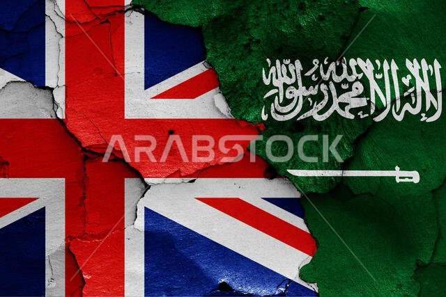 flags of UK and Saudi Arabia painted on cracked wall