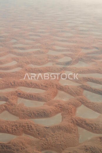 Aerial view of the colorful sand dunes of the Rub' al Khali desert, the so-called Empty Quarter, in the Eastern part of Saudi Arabia