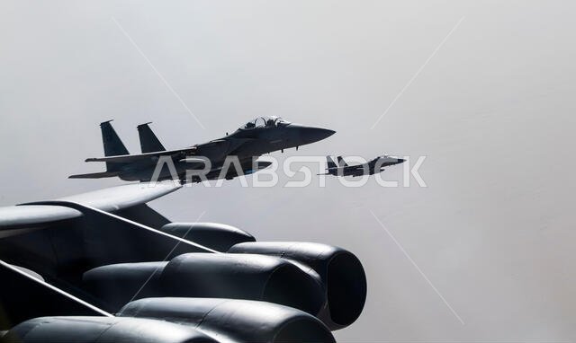 A U.S. Air Force B-52H Stratofortress is escorted by Saudi Arabian F-15C Eagles in support of Bomber Task Force Europe 20-1, Nov. 1, 2019, above Saudi Arabia. The Stratofortress conducted a sortie to the U.S. Central Command area of operations in order to conduct interoperability training with Saudi partners in support of shared regional security interests. (U.S. Air Force photo by Tech. Sgt. Christopher Ruano)