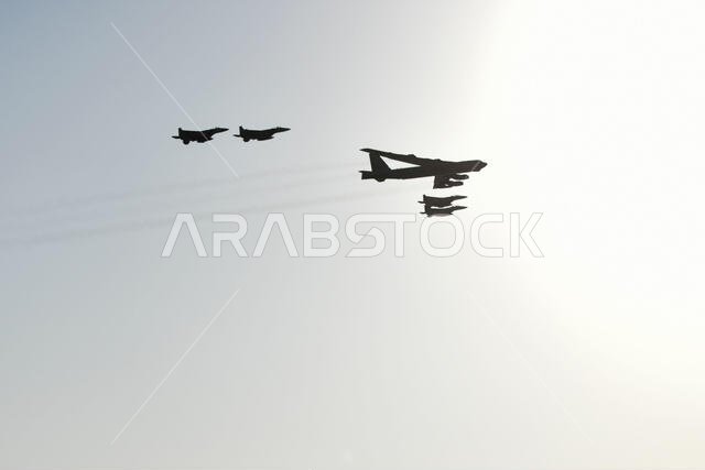 A U.S. Air Force B-52H Stratofortress, accompanied by four Saudi Arabian F-15C Eagles, conducts a low pass over Prince Sultan Air Base, Saudi Arabia, Nov. 1, 2019. The B-52H, deployed from Barksdale Air Force Base, La., is part of a Bomber Task Force operating out of RAF Fairford, England. The aircraft is a long-range strategic bomber capable of delivering massive amounts of precision weapons against any adversary. The bomber conducted a sortie to the U.S. Central Command area of operations in o