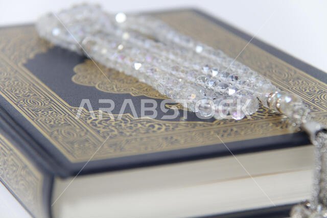 Holy islamic book Koran and rosary