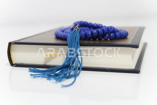 Holy islamic book Koran and rosary