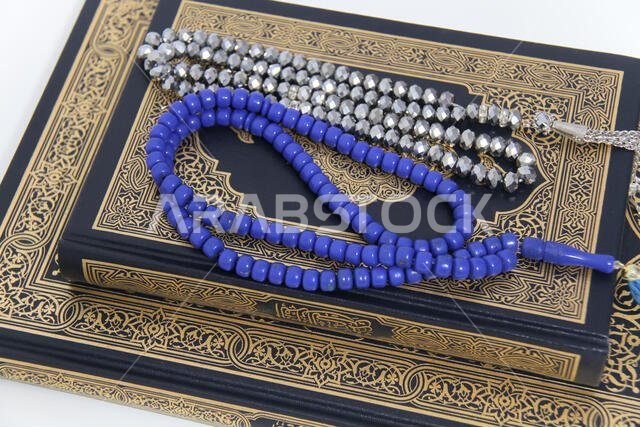 Holy islamic book Koran and rosary