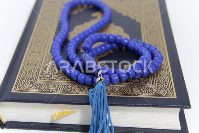 Holy islamic book Koran and rosary