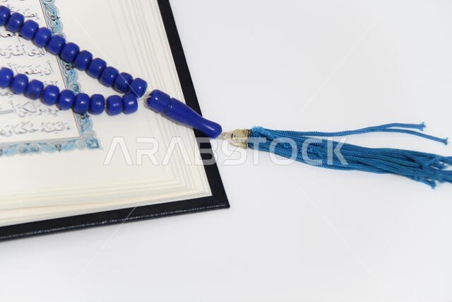 Holy islamic book Koran and rosary