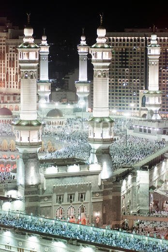 Thousands of Muslims gather around the holy Kaaba, cube at centre, of the Grand Mosque during evening prayer in the holy city of Mecca in Saudi Arabia