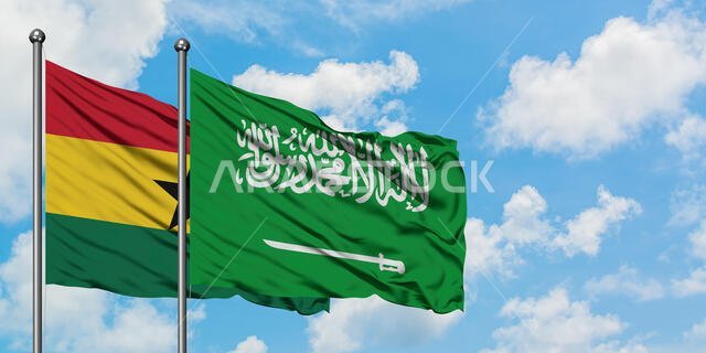 Ghana and Saudi Arabia flag waving in the wind against white cloudy blue sky together. Diplomacy concept, international relations.