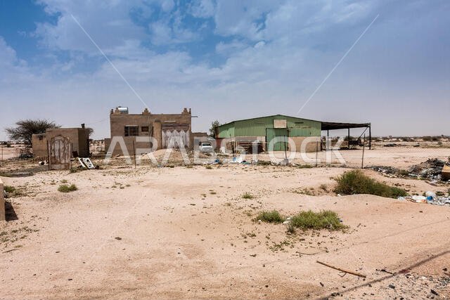 A typical family household with a small car repair business along the Makkah al Mukarramah Road, Saudi Arabia A typical family household with a small car repair business along the Makkah al Mukarramah Road, Saudi Arabia