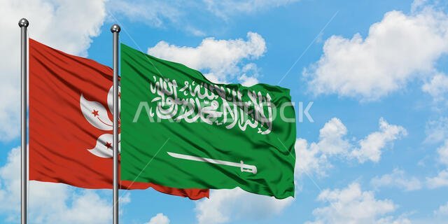 Hong Kong and Saudi Arabia flag waving in the wind against white cloudy blue sky together. Diplomacy concept, international relations.