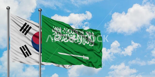South Korea and Saudi Arabia flag waving in the wind against white cloudy blue sky together. Diplomacy concept, international relations.