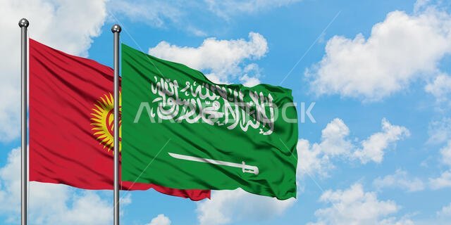 Kyrgyzstan and Saudi Arabia flag waving in the wind against white cloudy blue sky together. Diplomacy concept, international relations.