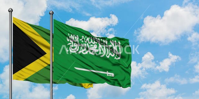 Jamaica and Saudi Arabia flag waving in the wind against white cloudy blue sky together. Diplomacy concept, international relations.