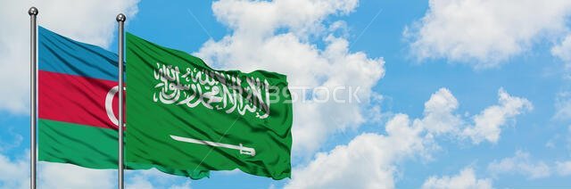 Azerbaijan and Saudi Arabia flag waving in the wind against white cloudy blue sky together. Diplomacy concept, international relations.