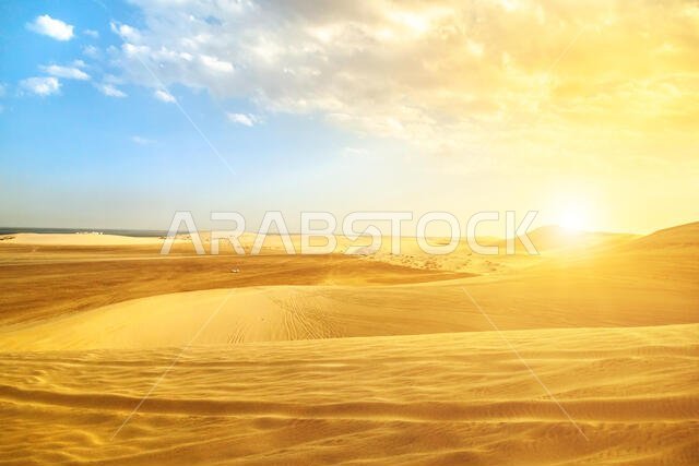Desert landscape sand dunes at sunset near Qatar and Saudi Arabia border on Persian Gulf, Khor Al Udeid (Khawr al Udayd), Qatar, Middle East