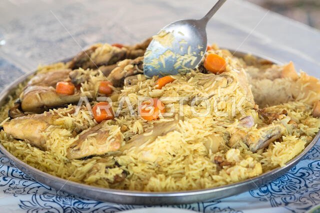 Pilaf -  rice with meat, potatoes and carrots.The dish includes chicken meat, rice, and fried vegetables .