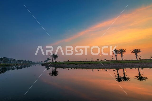 مشهد شروق الشمس الرائع في بحيرة مدن بالدمام، المملكة العربية السعودية