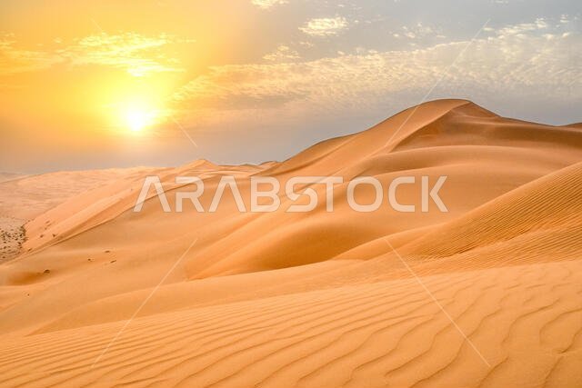 Sunset at the Edge of the Rolling Sand Dunes in the Empty Quarter (Arabian Desert) outside Abu Dhabi, United Arab Emirates