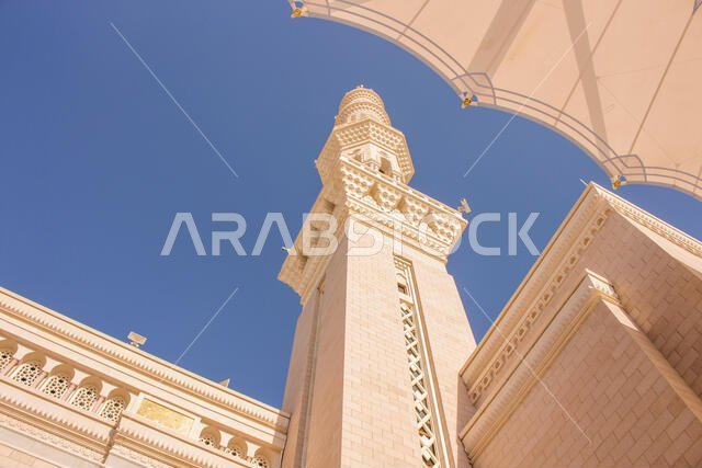 MADINAH, SAUDI ARABIA - AUGUST 2019 : Muslim pilgrims visiting the beautiful Nabawi Mosque destination, the Prophet mosque which has great architectur