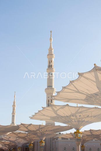 MADINAH, SAUDI ARABIA - AUGUST 2019 : Muslim pilgrims visiting the beautiful Nabawi Mosque destination, the Prophet mosque which has great architectur