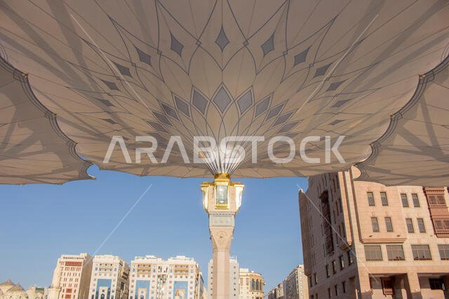 MADINAH, SAUDI ARABIA - AUGUST 2019 : Muslim pilgrims visiting the beautiful Nabawi Mosque destination, the Prophet mosque which has great architectur