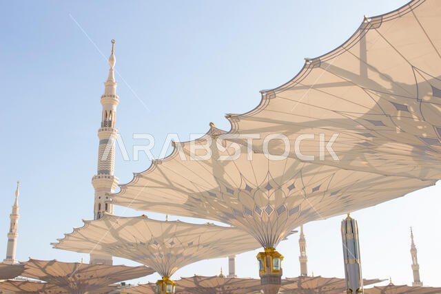MADINAH, SAUDI ARABIA - AUGUST 2019 : Muslim pilgrims visiting the beautiful Nabawi Mosque destination, the Prophet mosque which has great architectur