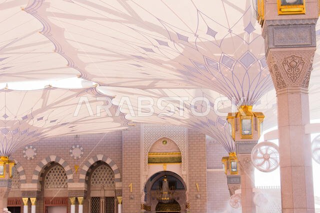 MADINAH, SAUDI ARABIA - AUGUST 2019 : Muslim pilgrims visiting the beautiful Nabawi Mosque destination, the Prophet mosque which has great architectur