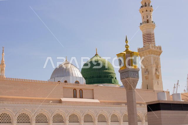 MADINAH, SAUDI ARABIA - AUGUST 2019 : Muslim pilgrims visiting the beautiful Nabawi Mosque destination, the Prophet mosque which has great architectur