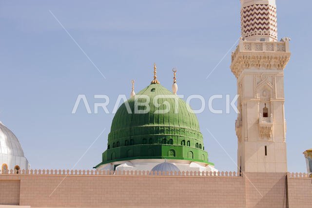 MADINAH, SAUDI ARABIA - AUGUST 2019 : Muslim pilgrims visiting the beautiful Nabawi Mosque destination, the Prophet mosque which has great architectur