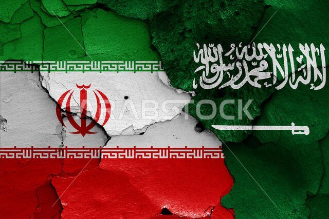 flags of Iran and Saudi Arabia painted on cracked wall