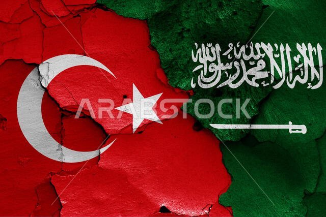 أعلام تركيا والسعودية مرسومة على جدار متصدع