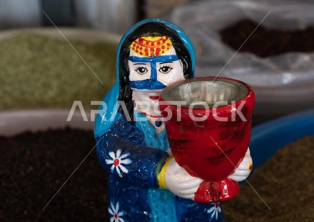Incense burner depicting a saudi woman with a niqab, Asir province, Abha, Saudi Arabia