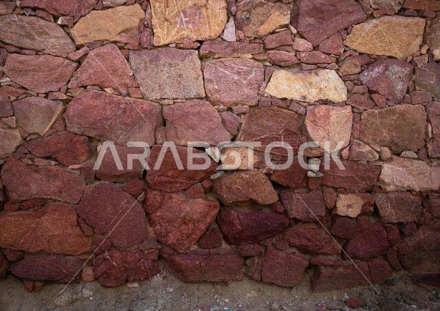 Red stones of a wall of a house, Asir province, Sarat Abidah, Saudi Arabia