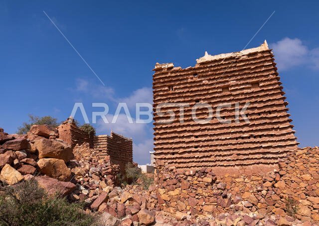 Red stone and mud houses with slates in a village, Asir province, Sarat Abidah, Saudi Arabia