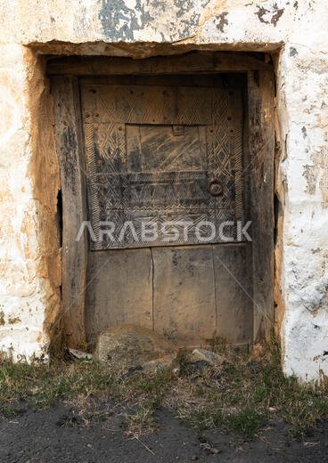Old wooden door of an abandonned house, Asir province, Al Olyyan, Saudi Arabia