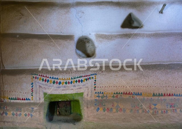 Al-qatt al-asiri traditionally female interior window decoration in an abandonned house, Asir province, Sarat Abidah, Saudi Arabia