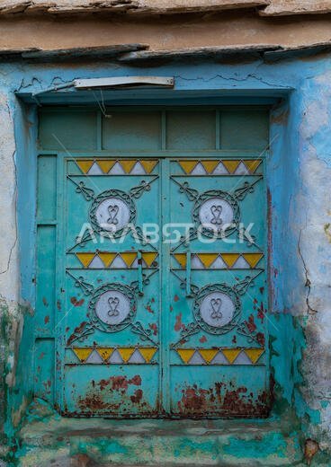 Old colorful door in al Khalaf village, Asir province, Sarat Abidah, Saudi Arabia