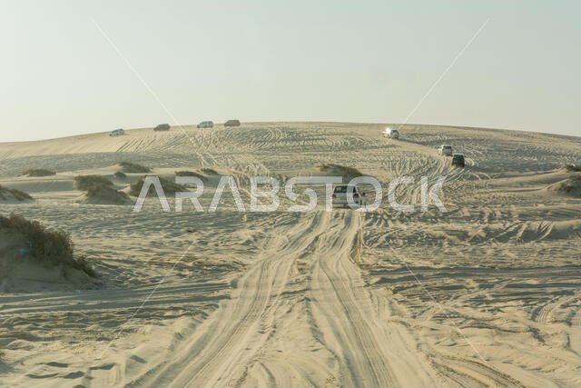 Khor Al Adaid, Qatar - November 5, 2016. 4WD vehicles driving on sand dunes in Khor Al Adaid desert in Qatar.