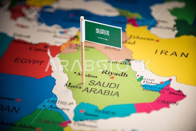 Saudi Arabia marked with a flag on the map