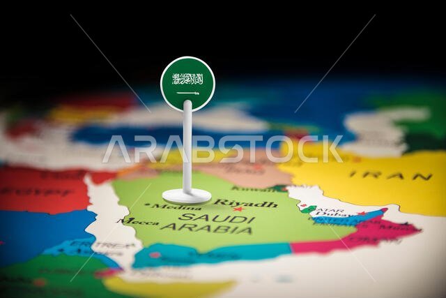 Saudi Arabia marked with a flag on the map