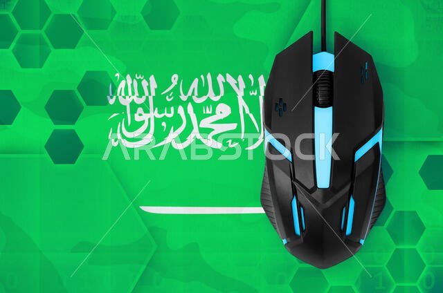 Saudi Arabia flag and modern backlit computer mouse. Concept of country representing e-sports team Saudi Arabia flag and modern backlit computer mouse. Concept of country representing e-sports team