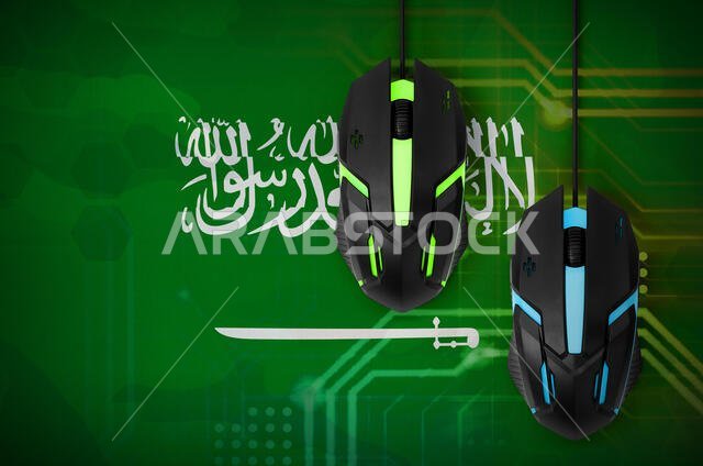 Saudi Arabia flag  and two modern computer mice with backlight. The concept of online cooperative games. Cyber sport team