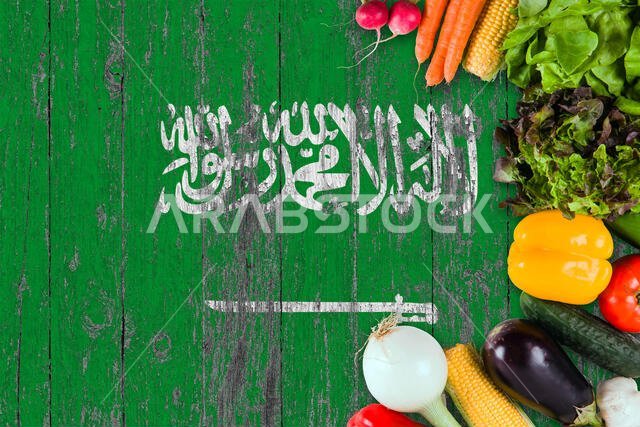 Fresh vegetables from Saudi Arabia on table. Cooking concept on wooden flag background.