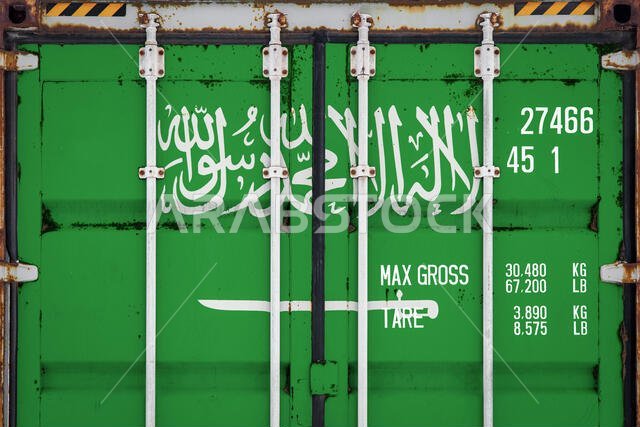 Close-up of the container with the national flag of Saudi Arabia. The concept of Saudi Arabia export-import and national delivery of goods.