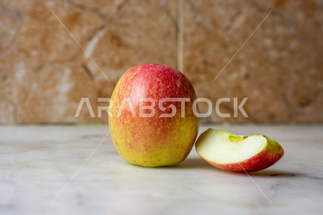 Close-up of apple fruit depicted on white marble background Fresh fruits healthy breakfast healthy diet delicious and healthy apple fruit summer fruit