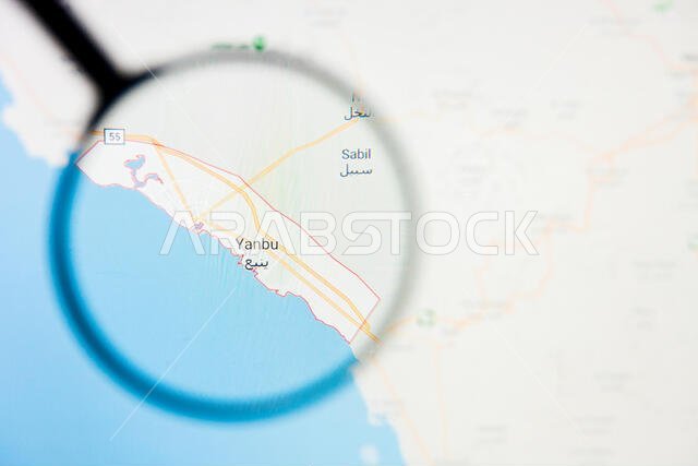 تصور مدينة ينبع في المملكة العربية السعودية، مفهوم توضيحي على الشاشة من خلال عدسة مكبرة