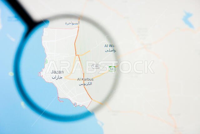 تصور مدينة جيزان في المملكة العربية السعودية، مفهوم توضيحي على الشاشة من خلال عدسة مكبرة تصور مدينة جيزان في المملكة العربية السعودية، مفهوم توضيحي على الشاشة من خلال عدسة مكبرة